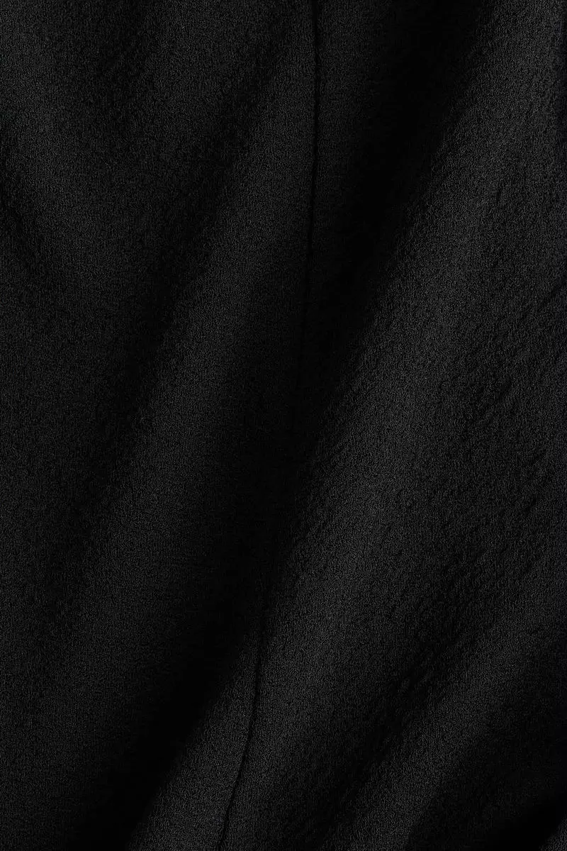 Sleeveless peplum top