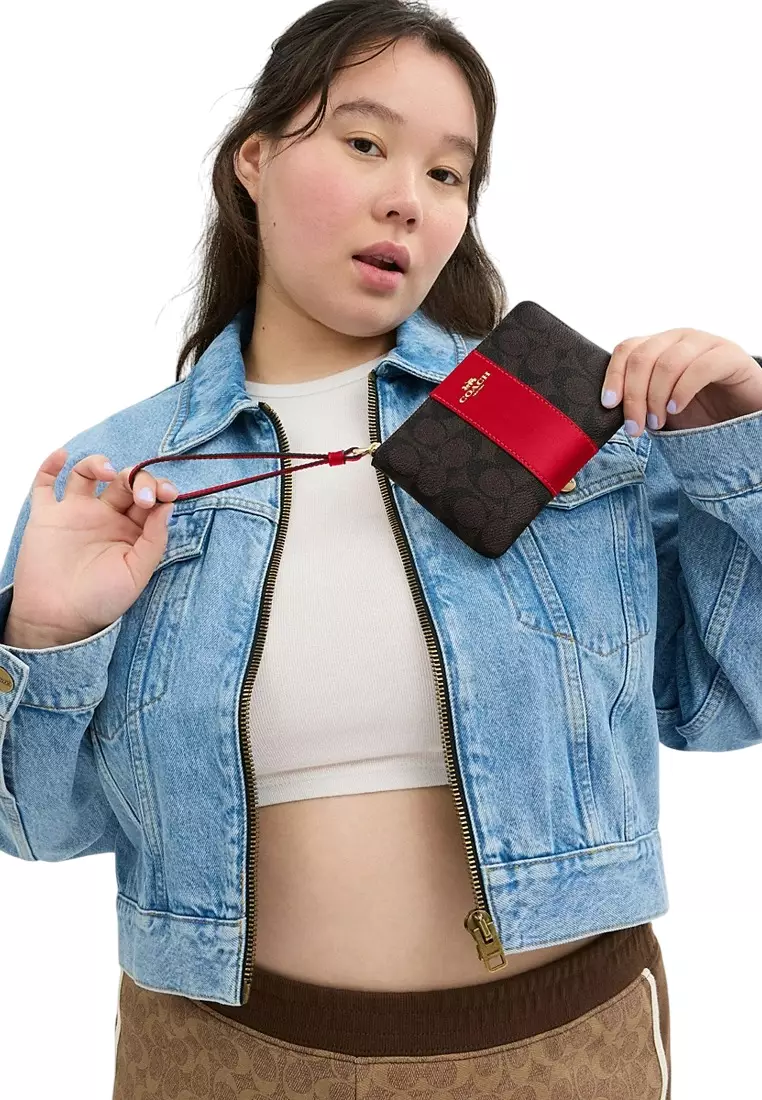 Buy Coach Corner Zip Wristlet In Signature Canvas With Stripe