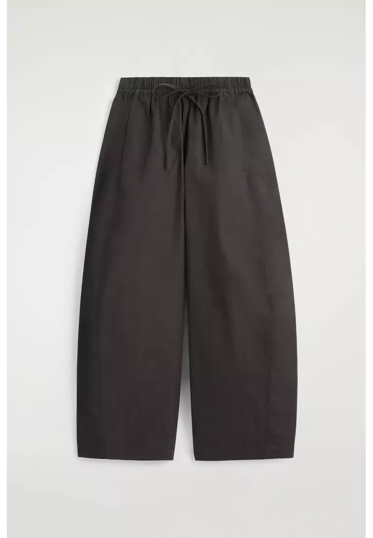 ELASTICATED BARREL-LEG TROUSERS