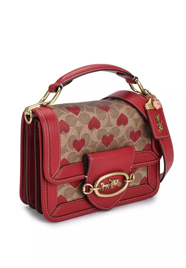 Coach bag with red discount handle