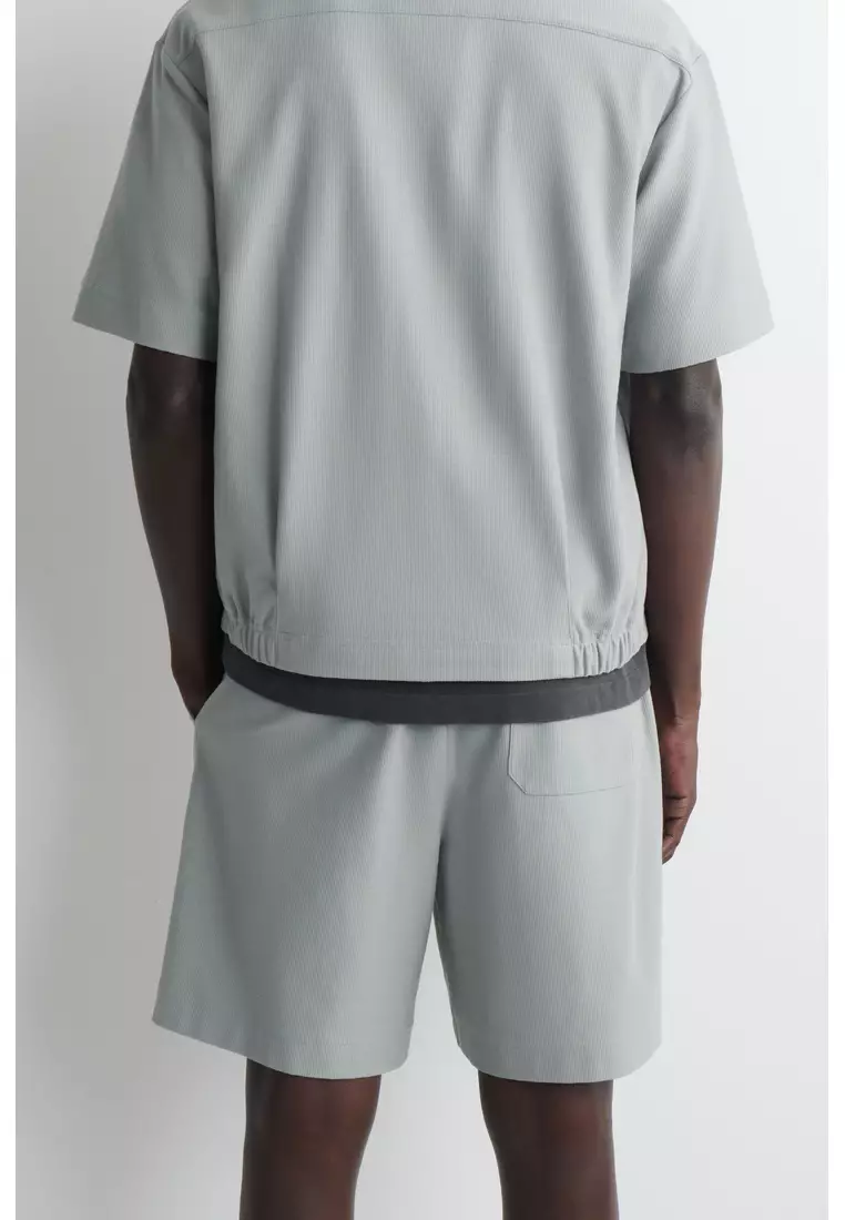 ELASTICATED COTTON-PIQUÉ SHORTS