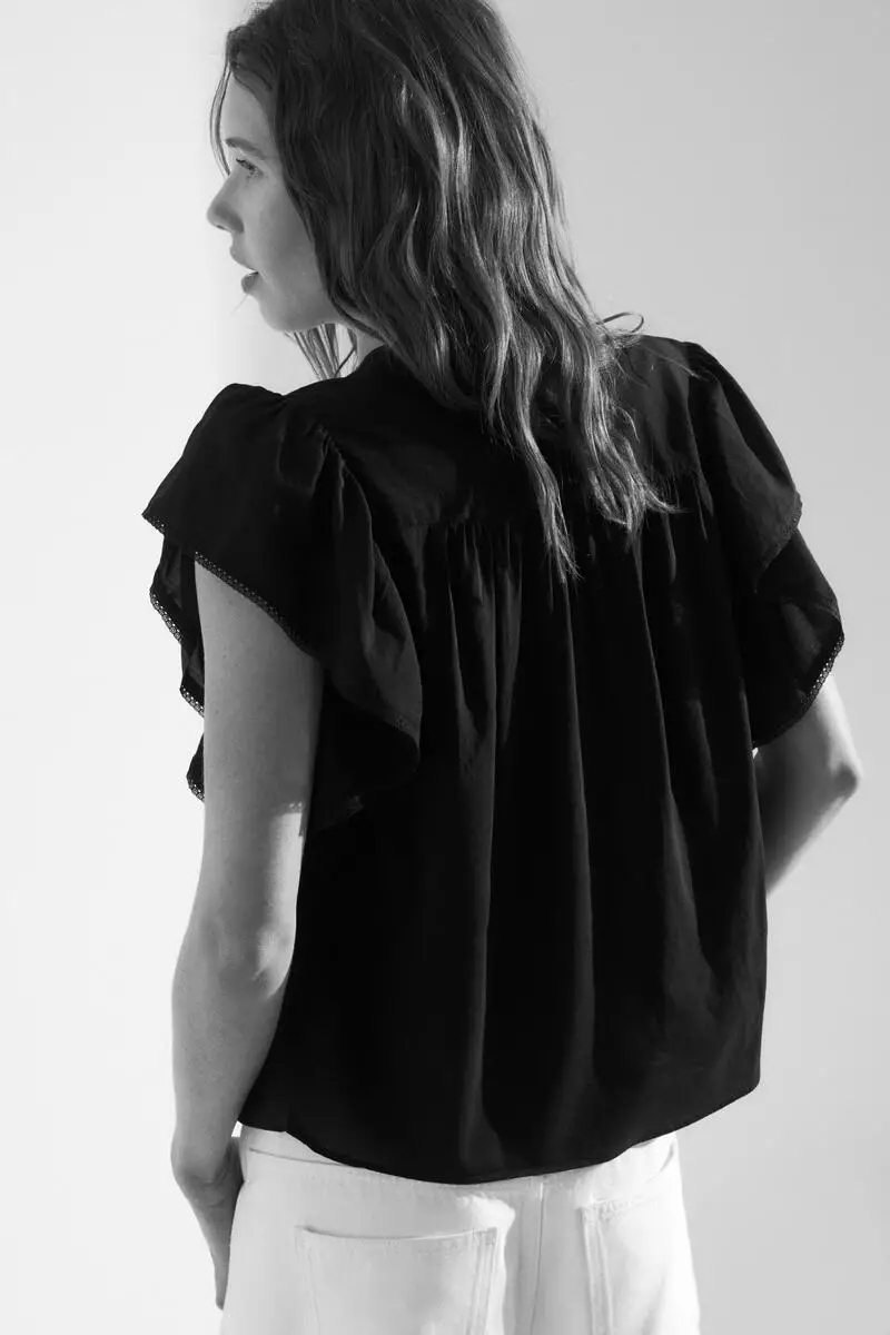 Flutter-sleeved lace-trimmed blouse