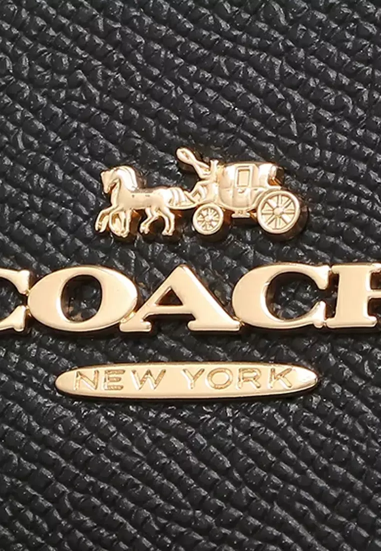 Gold coach bag best sale