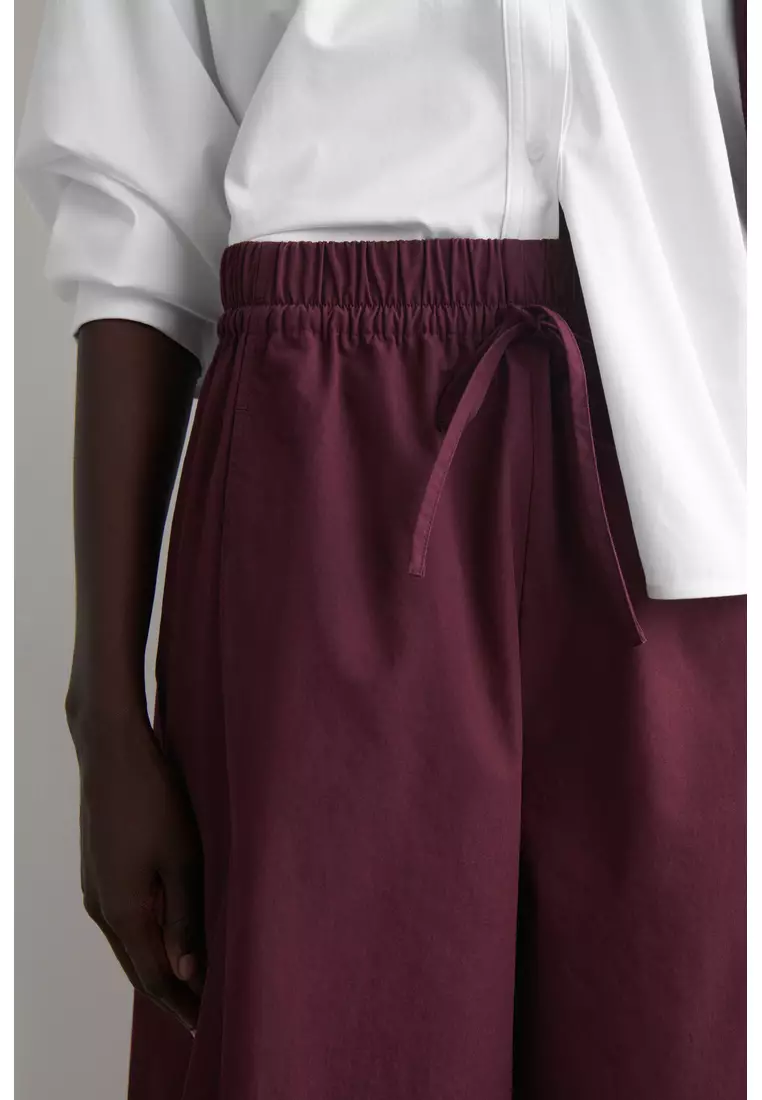 ELASTICATED BARREL-LEG TROUSERS