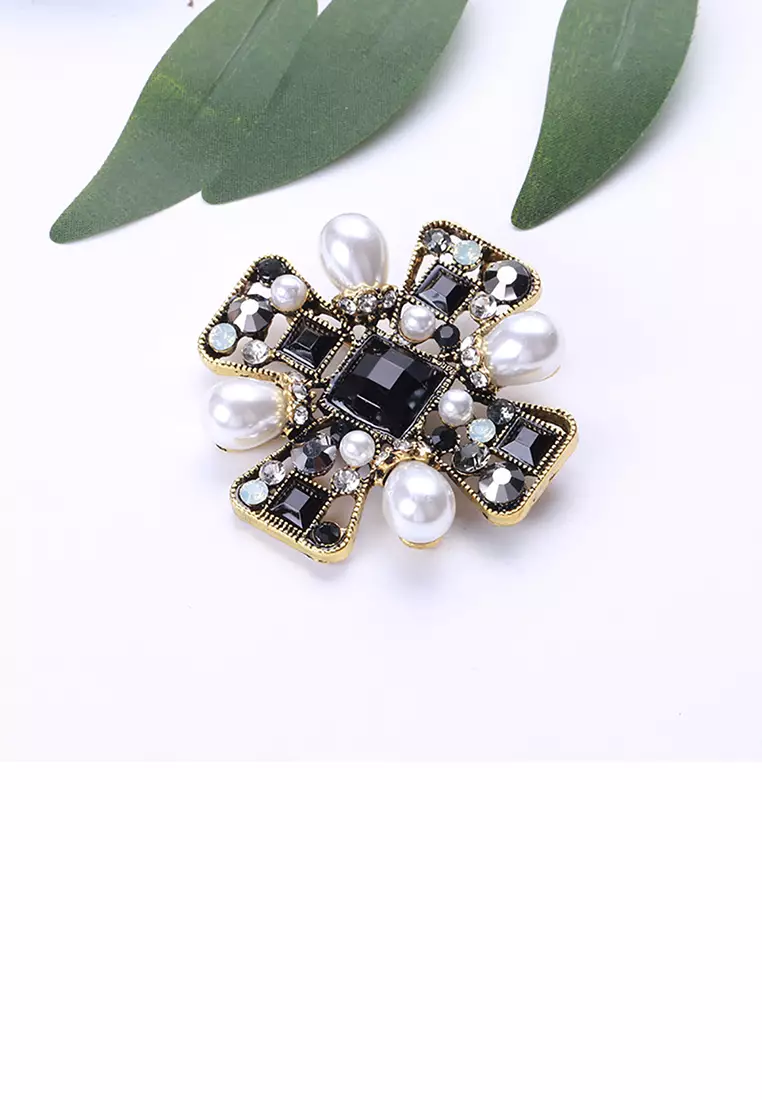 Gold cross store brooch