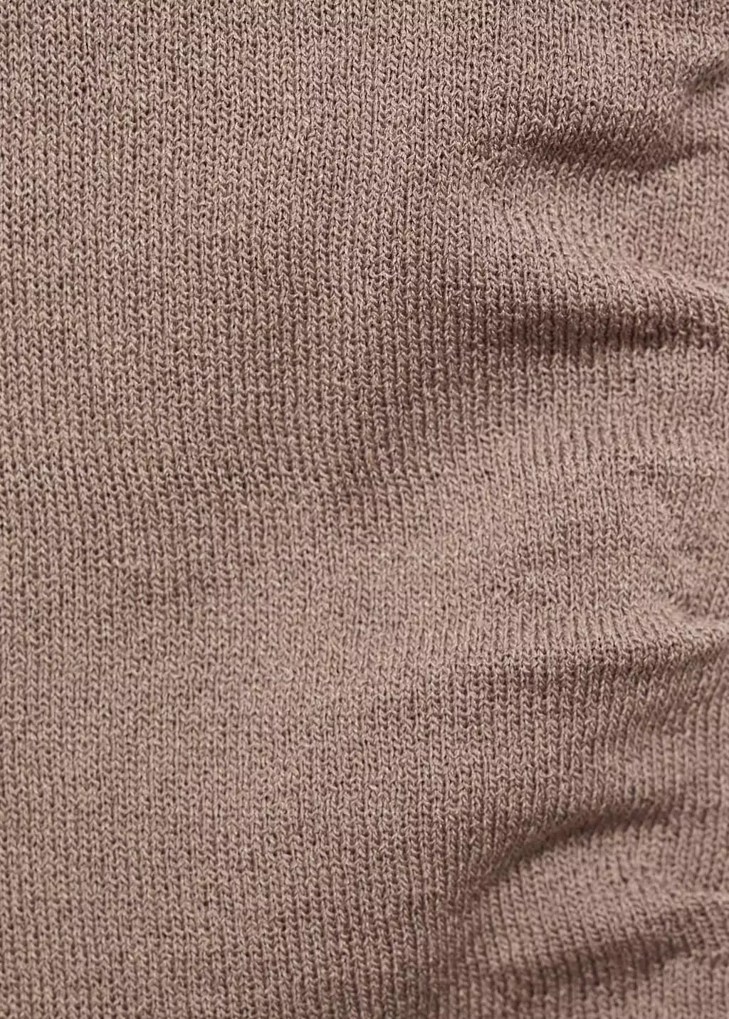 Atasan rajut dengan tali asimetris