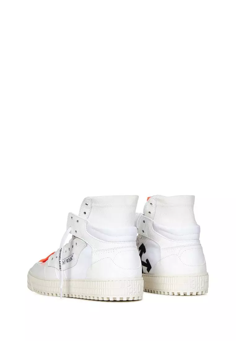 White sneakers with black on sale strap