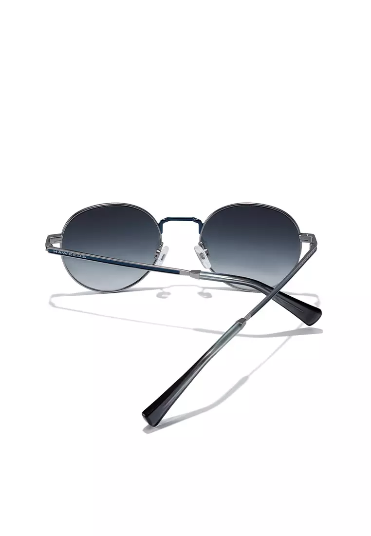 HAWKERS Silver Blue MOMA Sunglasses for Men and Women, Unisex. UV400 Protection. Official Product designed in Spain