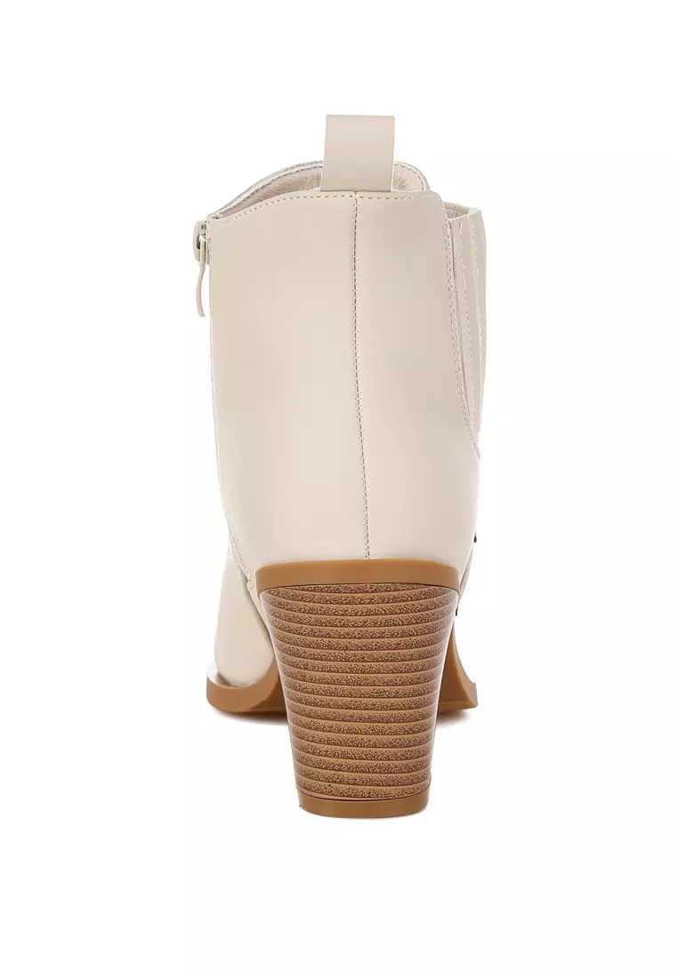 Sepatu bot Chelsea dengan detail bintang berkilauan dalam warna krem