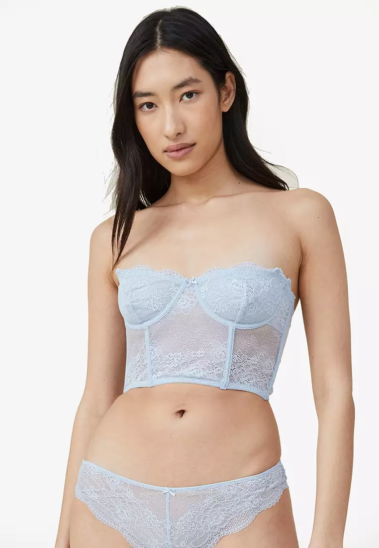 Nude corset bra with boning has a little lace in