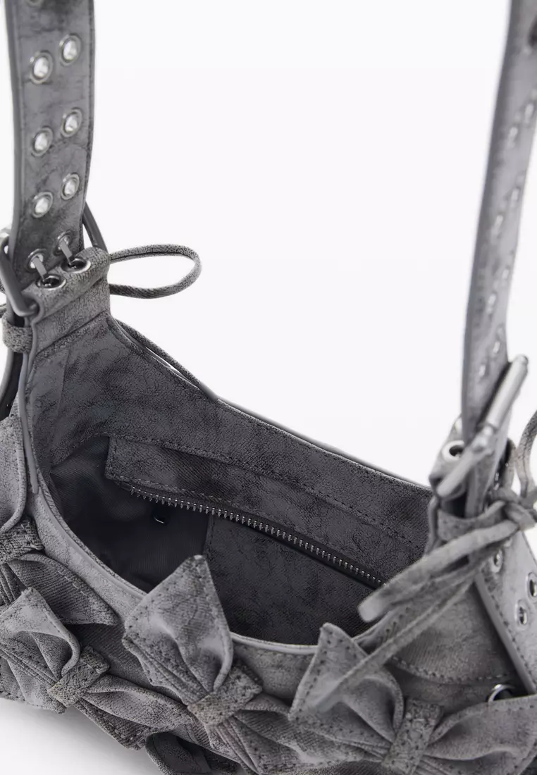 Handbag with small butterfly decoration