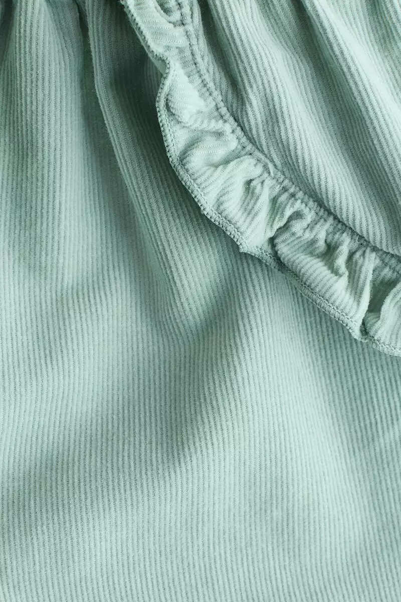 Frill-trimmed corduroy trousers