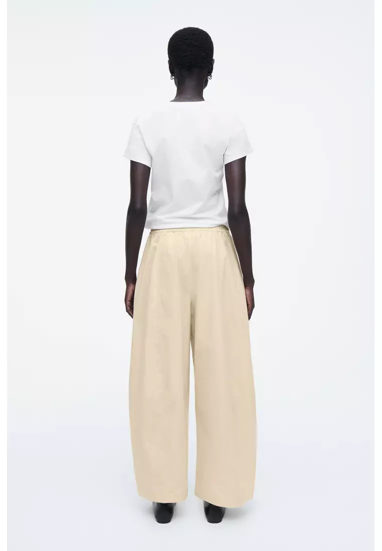 ELASTICATED BARREL-LEG TROUSERS