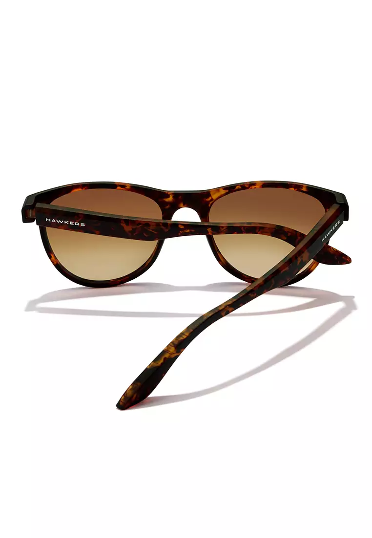HAWKERS Carey Peanut Butter Trail Sunglasses For Men And Women, Unisex. Official Product Designed In Spain
