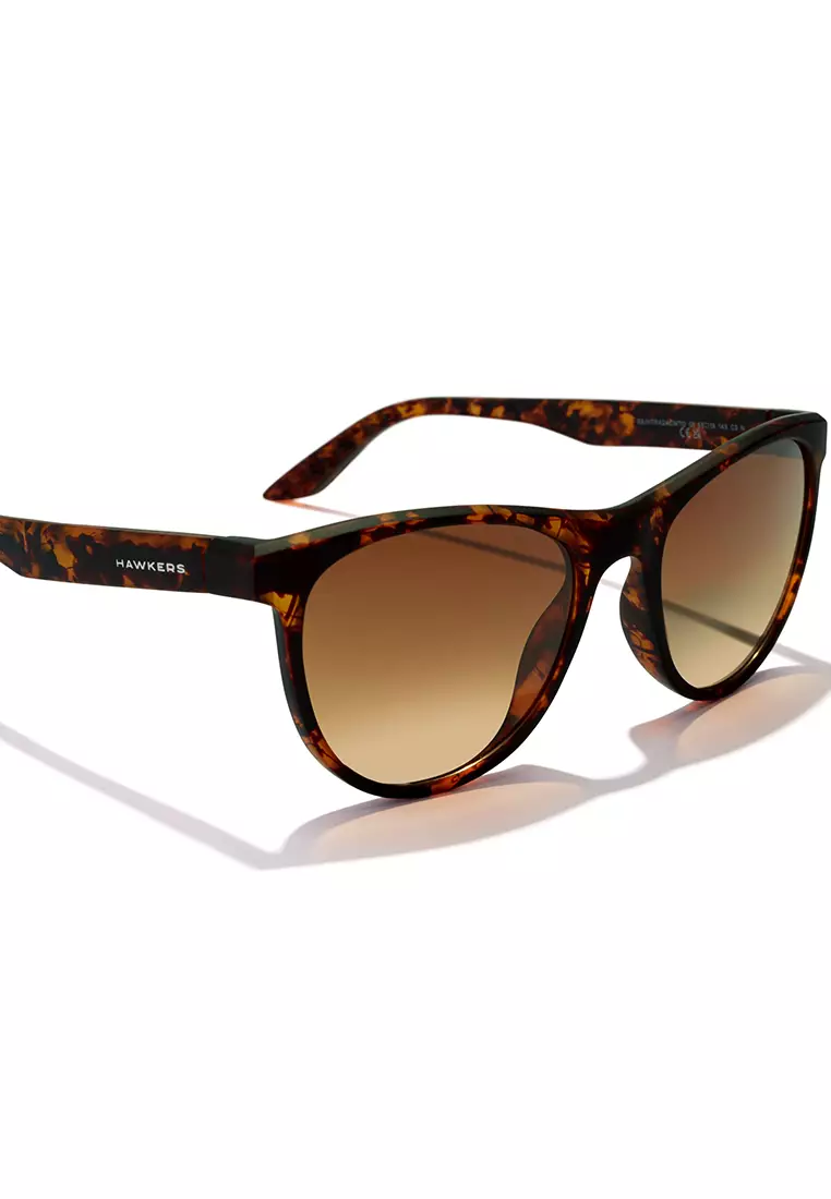 HAWKERS Carey Peanut Butter Trail Sunglasses For Men And Women, Unisex. Official Product Designed In Spain