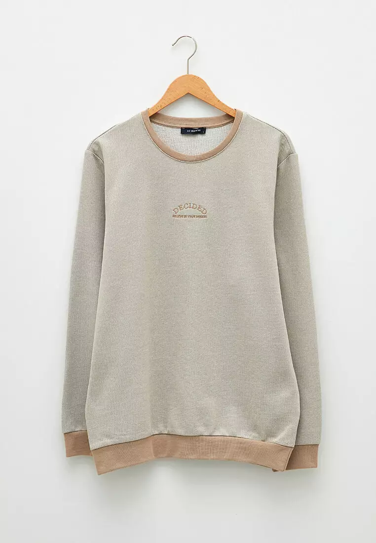 beige crewneck sweatshirt