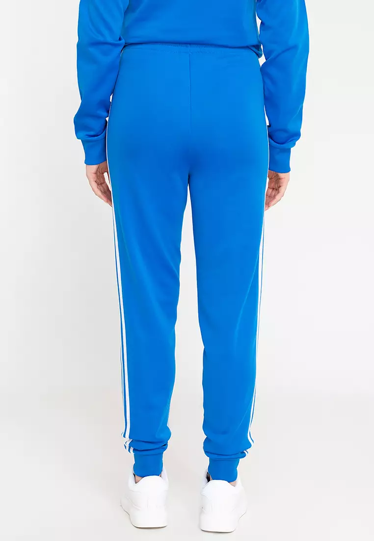 Adidas originals adicolor skinny joggers cuffed hem in blue store