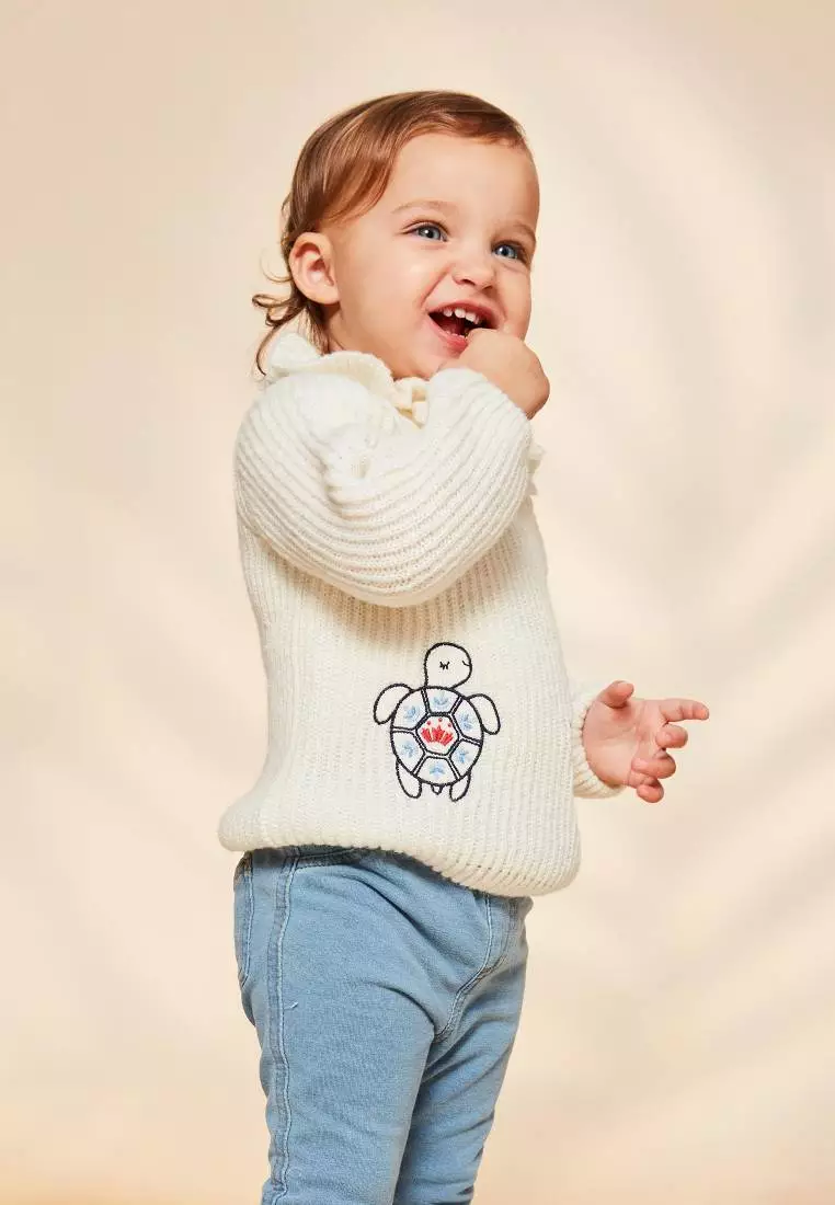 Ecru sweater with emboridery