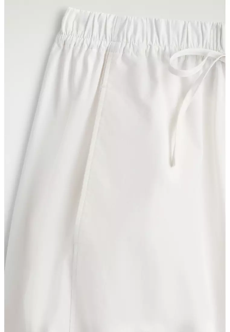 ELASTICATED BARREL-LEG TROUSERS