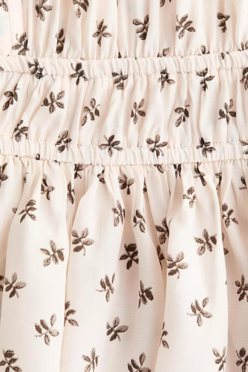 Flutter-sleeved peplum blouse