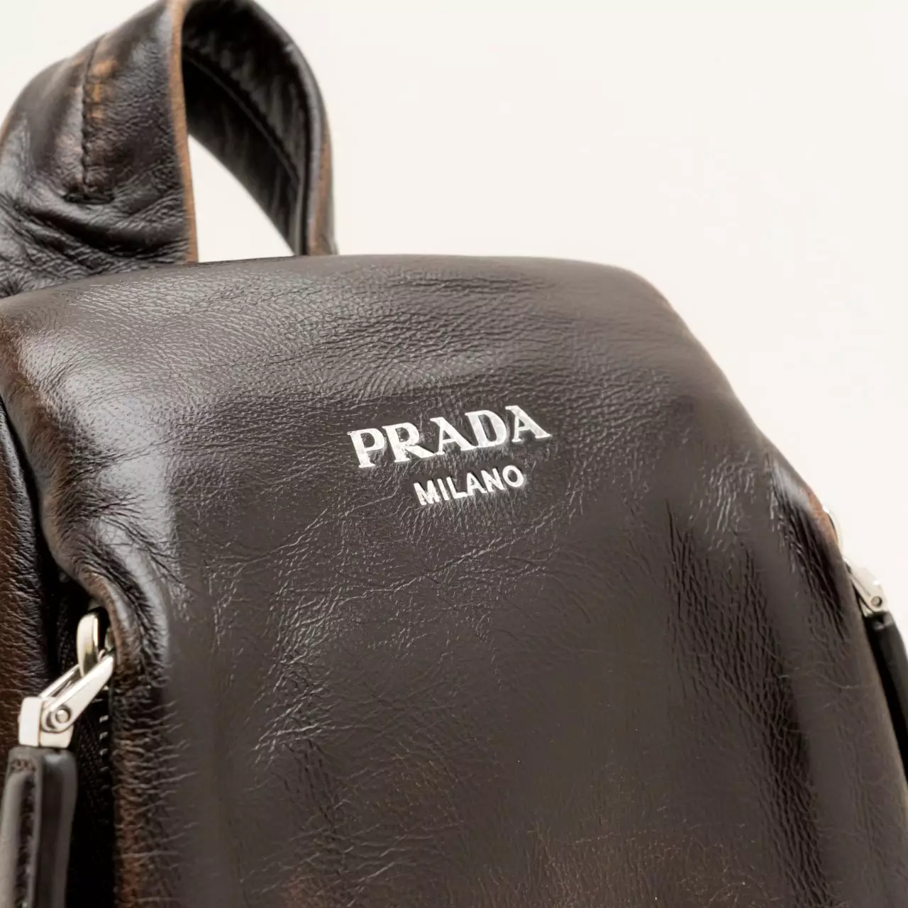 Triangle Logo Nappa Leather Sling Backpack Dark Brown