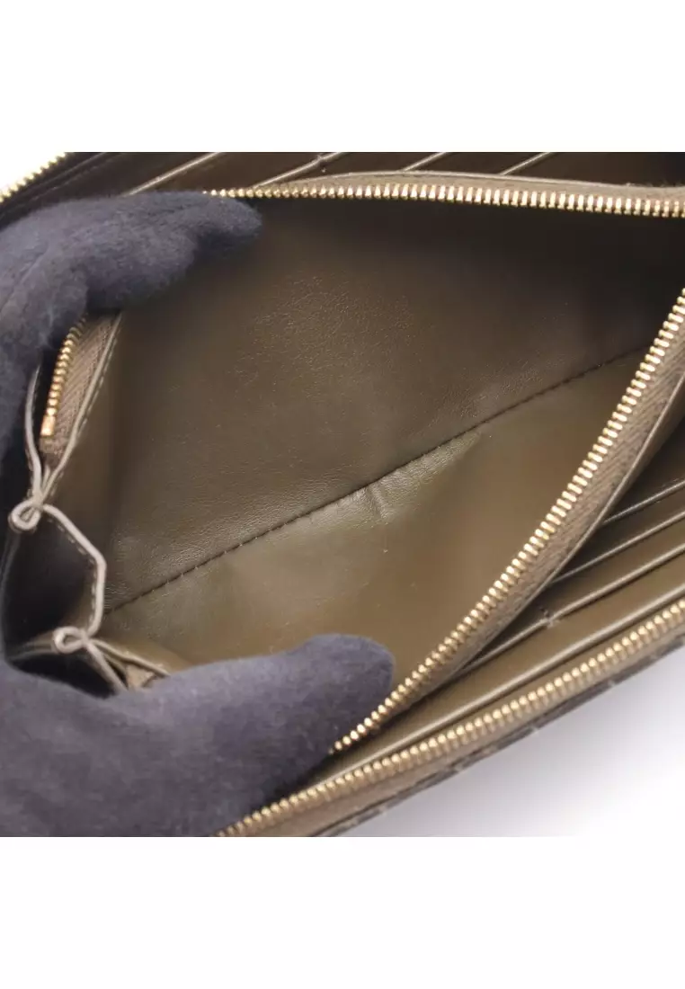 Pre-Loved Celine C-charm large zipped wallet round zipper long wallet quilting leather Khaki brown