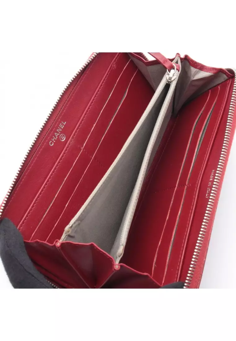 Pre-Loved Chanel round zipper long wallet Caviar skin Red silver hardware