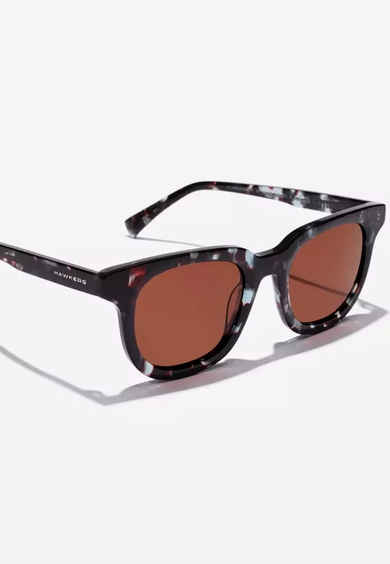 HAWKERS Blue Carey Brown Oasis Sunglasses For Men And Women, Unisex. Official Product Designed In Spain