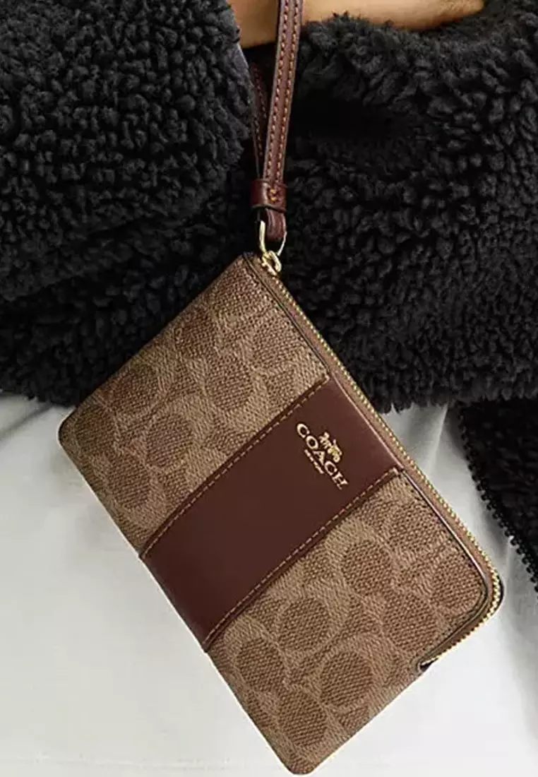 Buy Coach Corner Zip Wristlet In Signature Canvas With Stripe