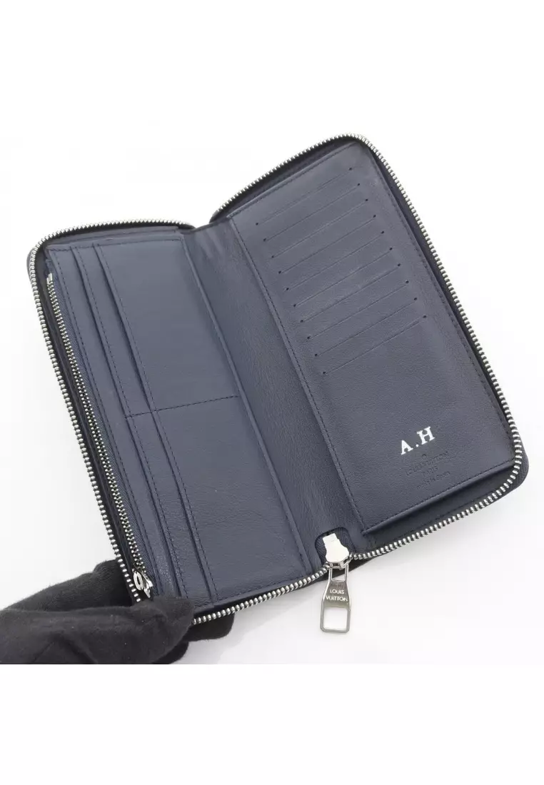 Pre-Loved Louis Vuitton zippy wallet Vertical round zipper long wallet taurillon leather Dark navy
