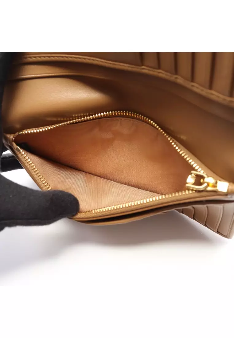 Pre-Loved MIU MIU matelasse Bi-fold Long Wallet leather light brown