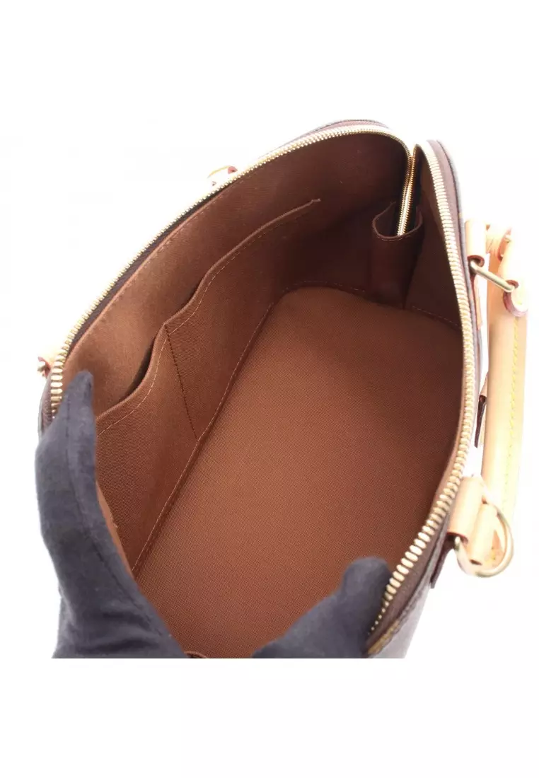 Pre-Loved Louis Vuitton Alma monogram Handbag PVC leather Brown