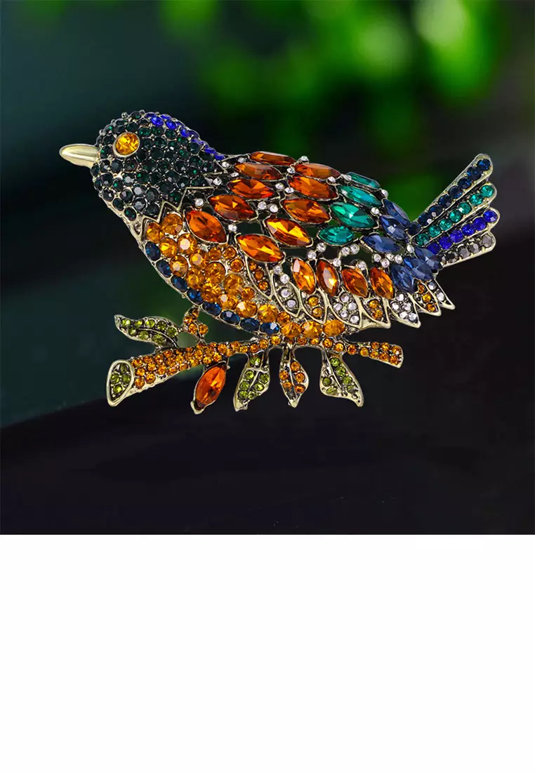 Gold store bird brooch