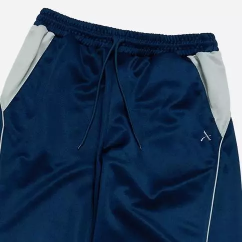 ONE POINT LOGO COLORING WIDE TRACK PANTS NAVY