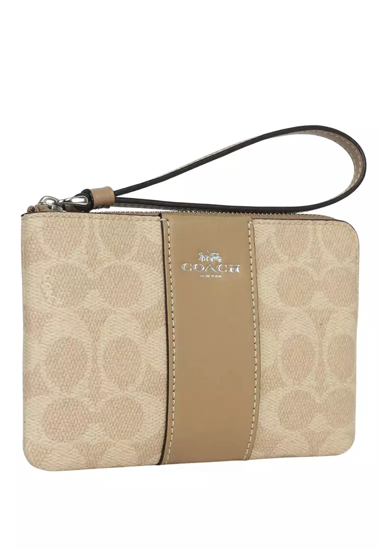 Buy COACH Corner Zip Wristlet In Signature Canvas With Stripe