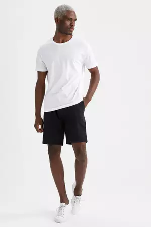White shirt and black sales shorts