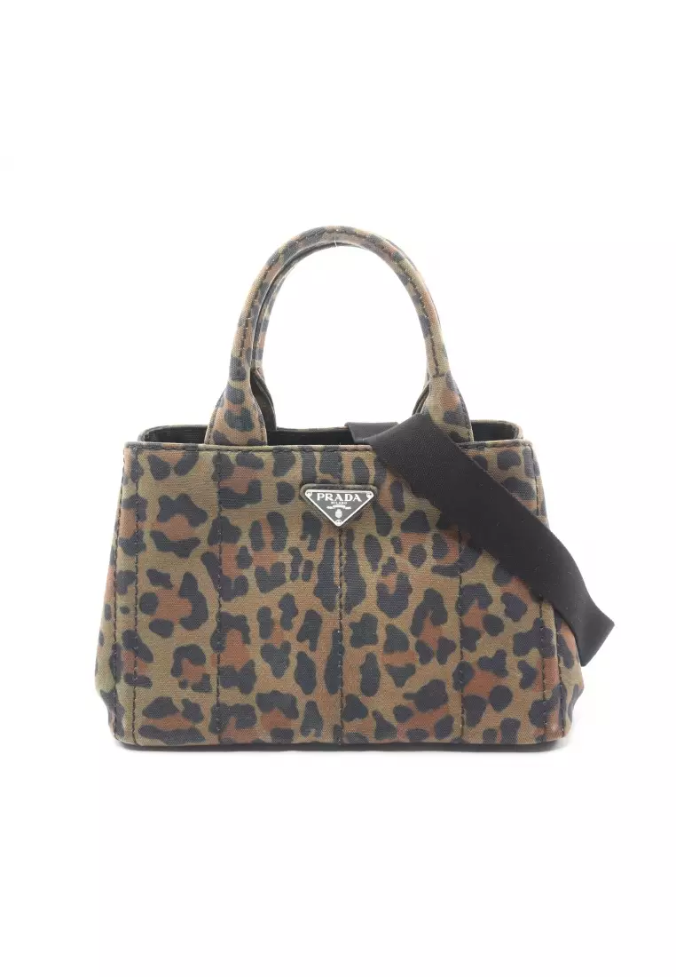 Prada cow best sale print bag