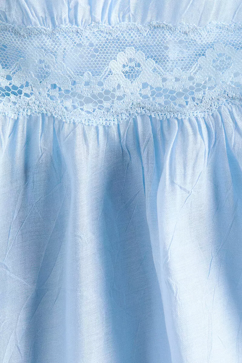 Lace-trimmed peplum top