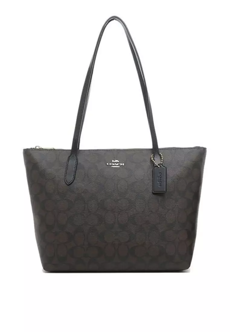 Tote with outlet zipper top