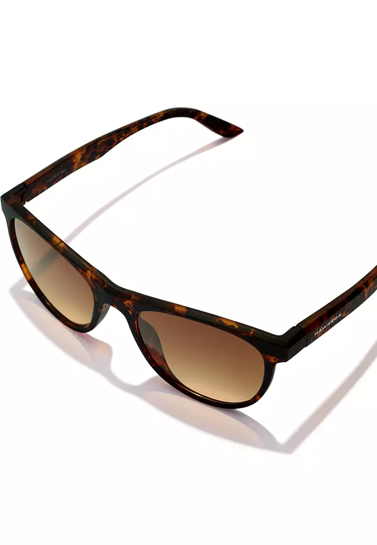 HAWKERS Carey Peanut Butter Trail Sunglasses For Men And Women, Unisex. Official Product Designed In Spain