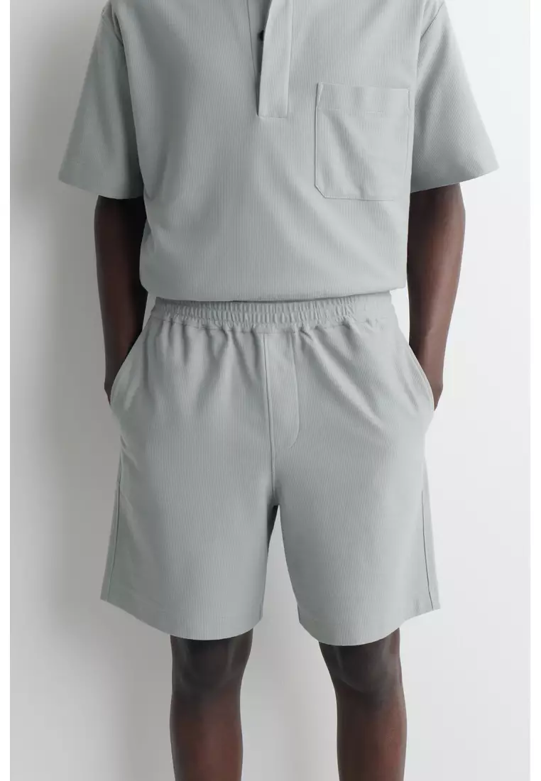 ELASTICATED COTTON-PIQUÉ SHORTS