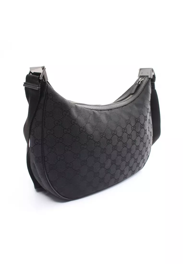 Gucci canvas sling bag 2025