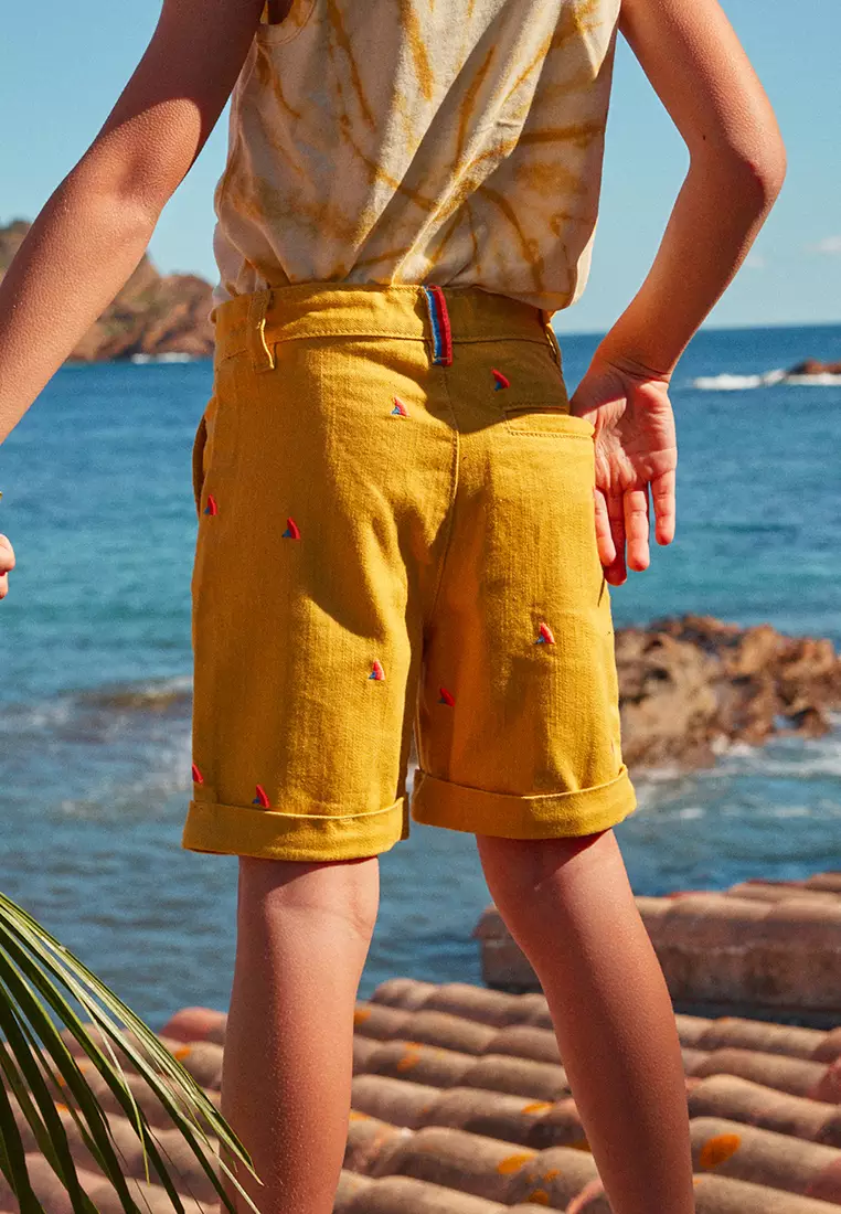 MUSTARD SHORTS WITH MULTICOLOURED SHARK FIN EMBROIDERIES