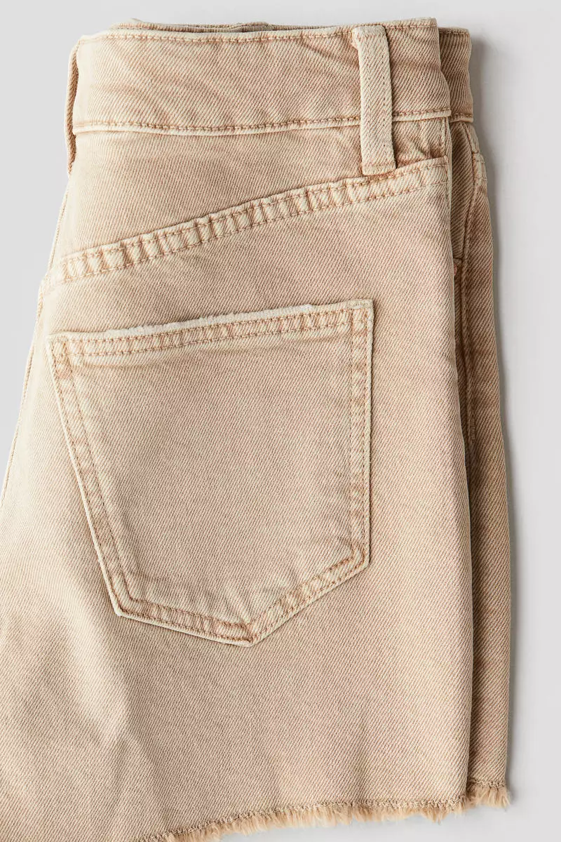 Raw-edge denim shorts
