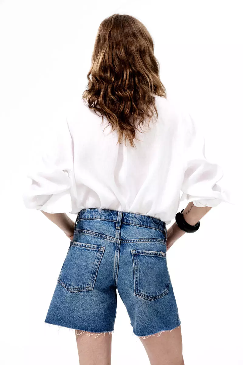 Raw-edge denim shorts