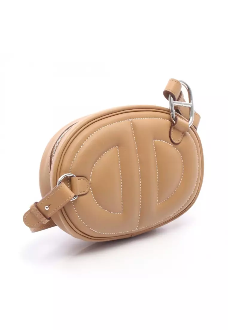 Pre-Loved Hermès in the loop belt bag Verso Sesame body bag Veau Swift light brown silver hardware Z stamp