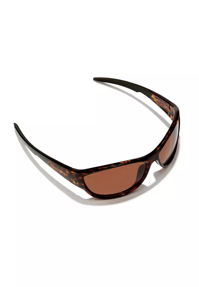 HAWKERS POLARIZED Carey Brown RAVE Sunglasses for Men and Women, Unisex. UV400 Protection. Official Product designed in Spain