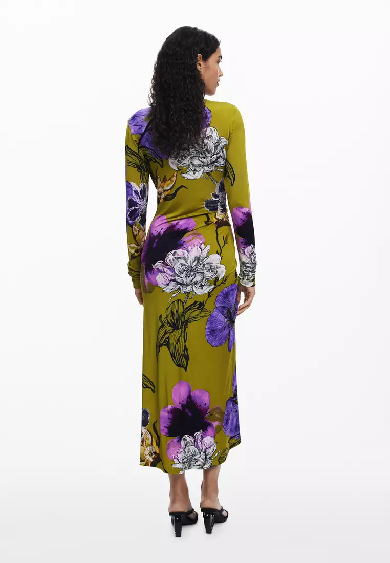 Asymmetric neckline dress designed by Mr. Christian Lacroix