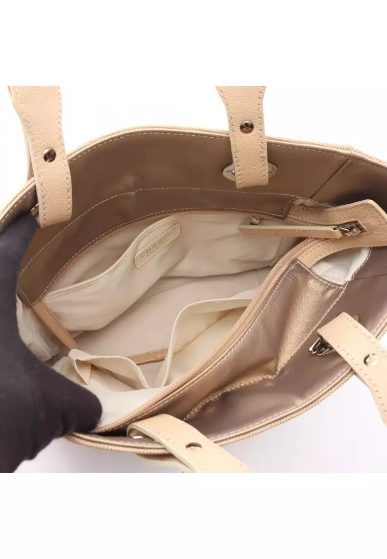 Pre-Loved Chanel Paris Biarritz PM Handbag tote bag Coated canvas leather Champagne Gold beige silver hardware