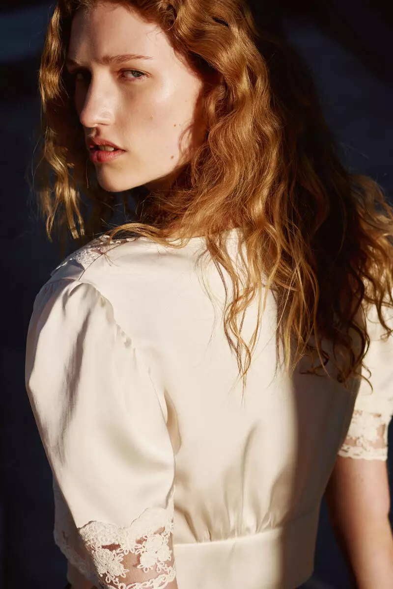 Cropped lace-trimmed top
